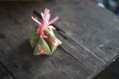 Close-up of red rose on table