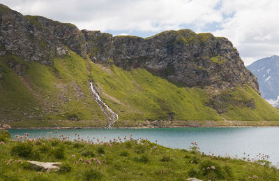 Scenic view of lake and mountains against sky