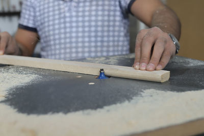 Close-up of man working on table