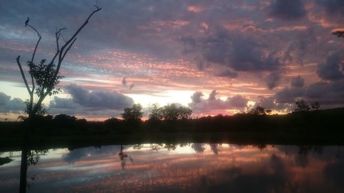 Scenic view of lake at sunset