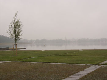 Scenic view of landscape against sky during foggy weather