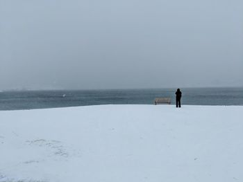Scenic view of sea against sky during winter