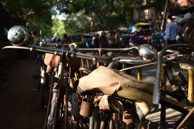 Close-up of bicycle parked on street in city