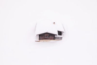 Close-up of model house against white background