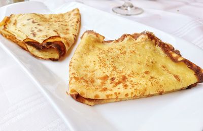 High angle view of pancakes in plate on table