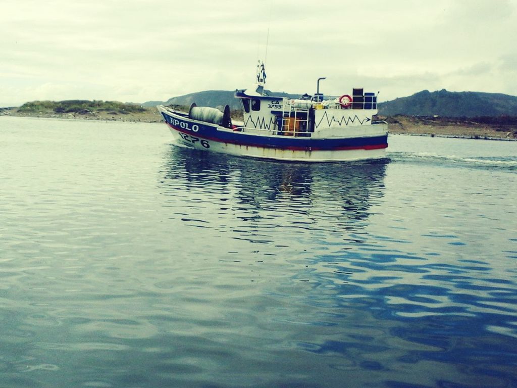 water, nautical vessel, transportation, mode of transport, boat, waterfront, sky, moored, rippled, tranquility, lake, cloud - sky, sea, tranquil scene, nature, river, travel, mountain, reflection, scenics