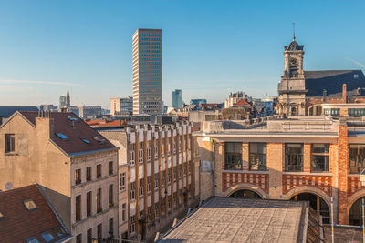 Buildings in city against sky