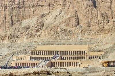 View of ancient building hatshepsut temple against cloudy sky