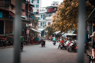 People riding bicycles on city street