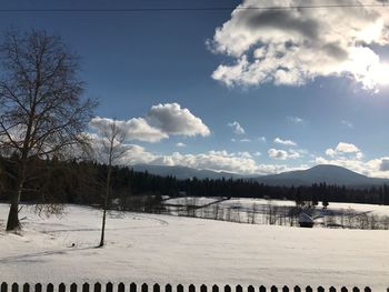 Scenic view of beach against sky during winter