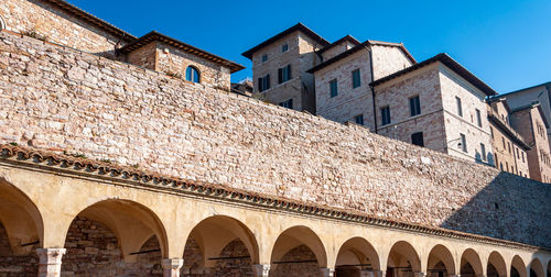 Low angle view of historical building against blue sky