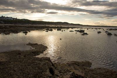 Scenic view of lake against sky during sunset