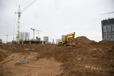 Track-type excavator during earthmoving at construction site. backhoe digging the ground f