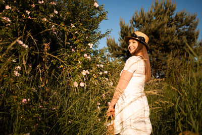 Portrait of young woman wearing hat