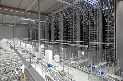 Automated warehouse. boxes with spare parts moving on conveyer