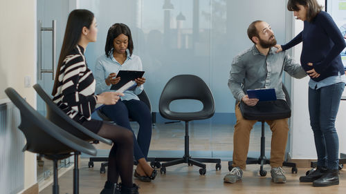 Side view of business colleagues working at airport