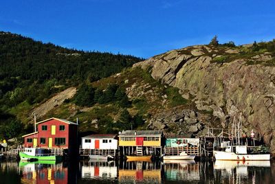 Calm sea with buildings in background