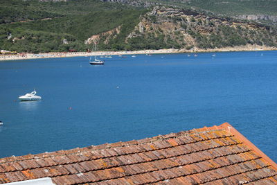 High angle view of sailboats by sea