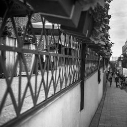 Footpath amidst buildings in city