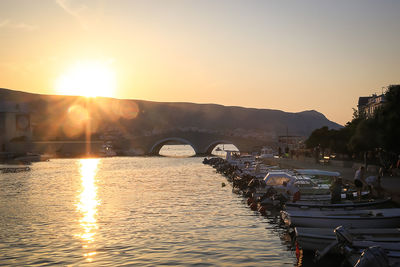 View of bridge over river against sky during sunset