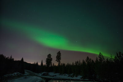 Scenic view of mountains against sky at night