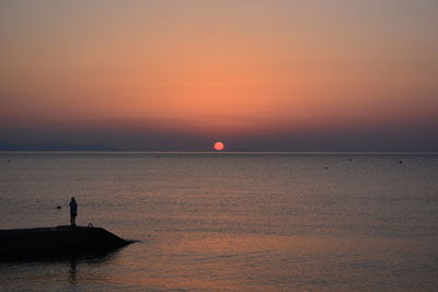 Scenic view of sea during sunset