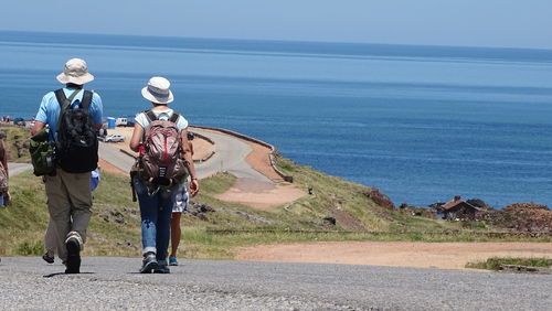 View of road by sea against sky