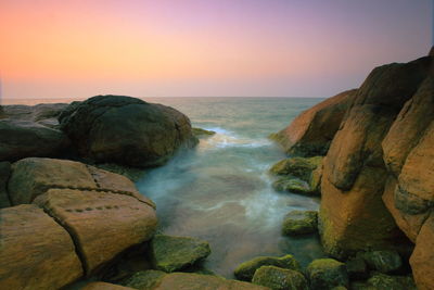 Scenic view of sea at sunset