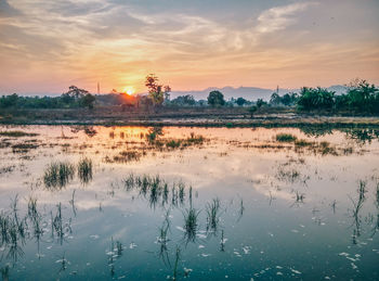 Scenic view of landscape against sky during sunset