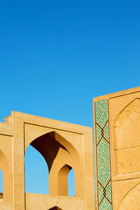 Low angle view of building against blue sky