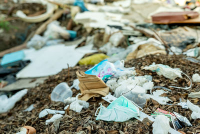Close-up of garbage in field
