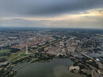 High angle view of buildings against cloudy sky
