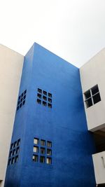 Low angle view of building against blue sky