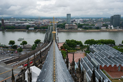 High angle view of bridge over river amidst buildings in city