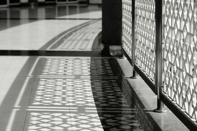 Shadow of railing on floor