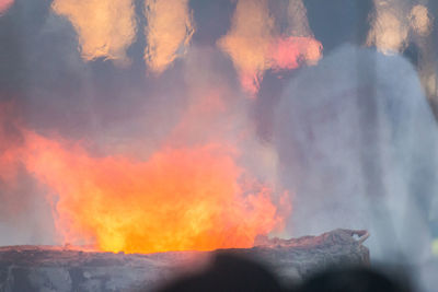 Low angle view of fire against the sky