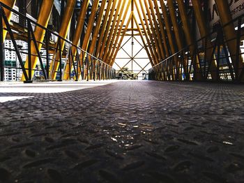 Surface level of bridge over road against buildings