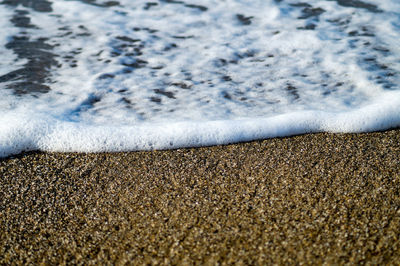 Close-up of sea waves rushing towards shore