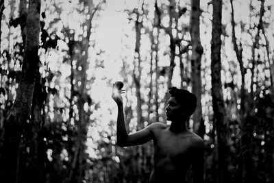 Side view of man holding umbrella
