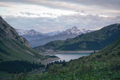 Scenic view of lake and mountains against sky