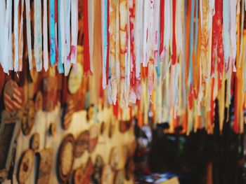 Close-up of clothes hanging for sale