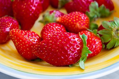 Close-up of strawberries in plate on table