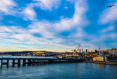 Bridge over river with city in background