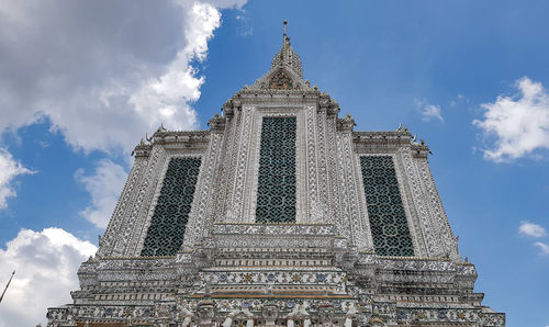 Low angle view of temple against cloudy sky