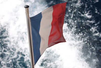 Low angle view of flag against sky