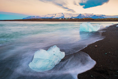 Scenic view of frozen sea against sky