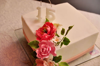 High angle view of rose petals on table