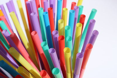 Close-up of colored pencils on white background