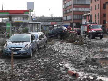 Vehicles on road along buildings