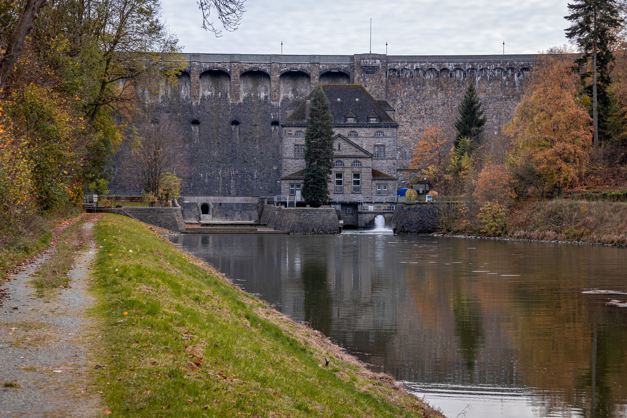 water, river, waterway, architecture, built structure, reflection, moat, plant, tree, nature, bridge, ditch, building exterior, transportation, no people, reservoir, autumn, sky, transport, history, château, day, the past, outdoors, travel destinations, pond, travel